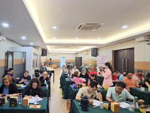 DCK trainer moving through a busy practical workshop in Klang