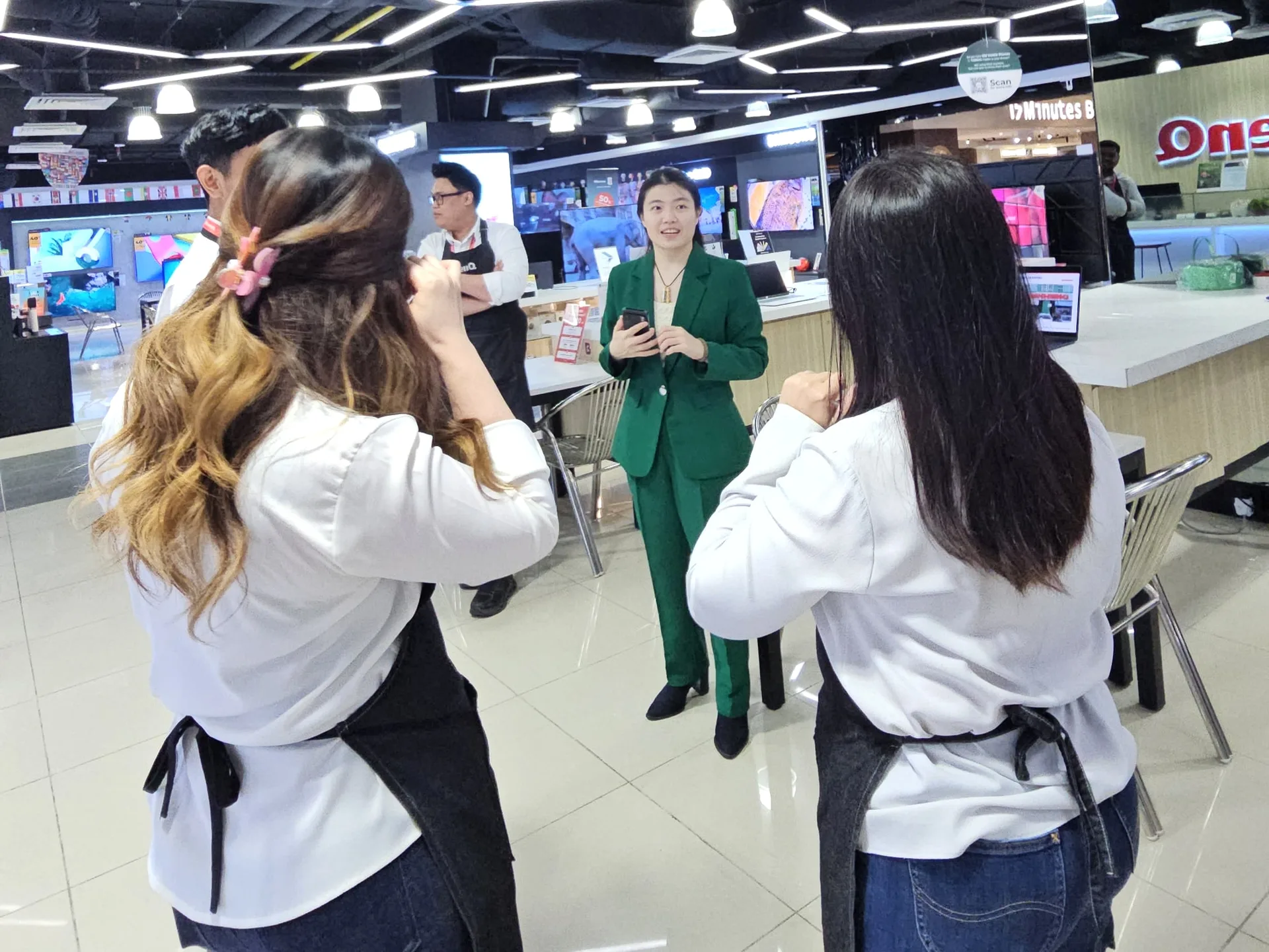 DCK trainer being filmed during an in-store social-content exercise