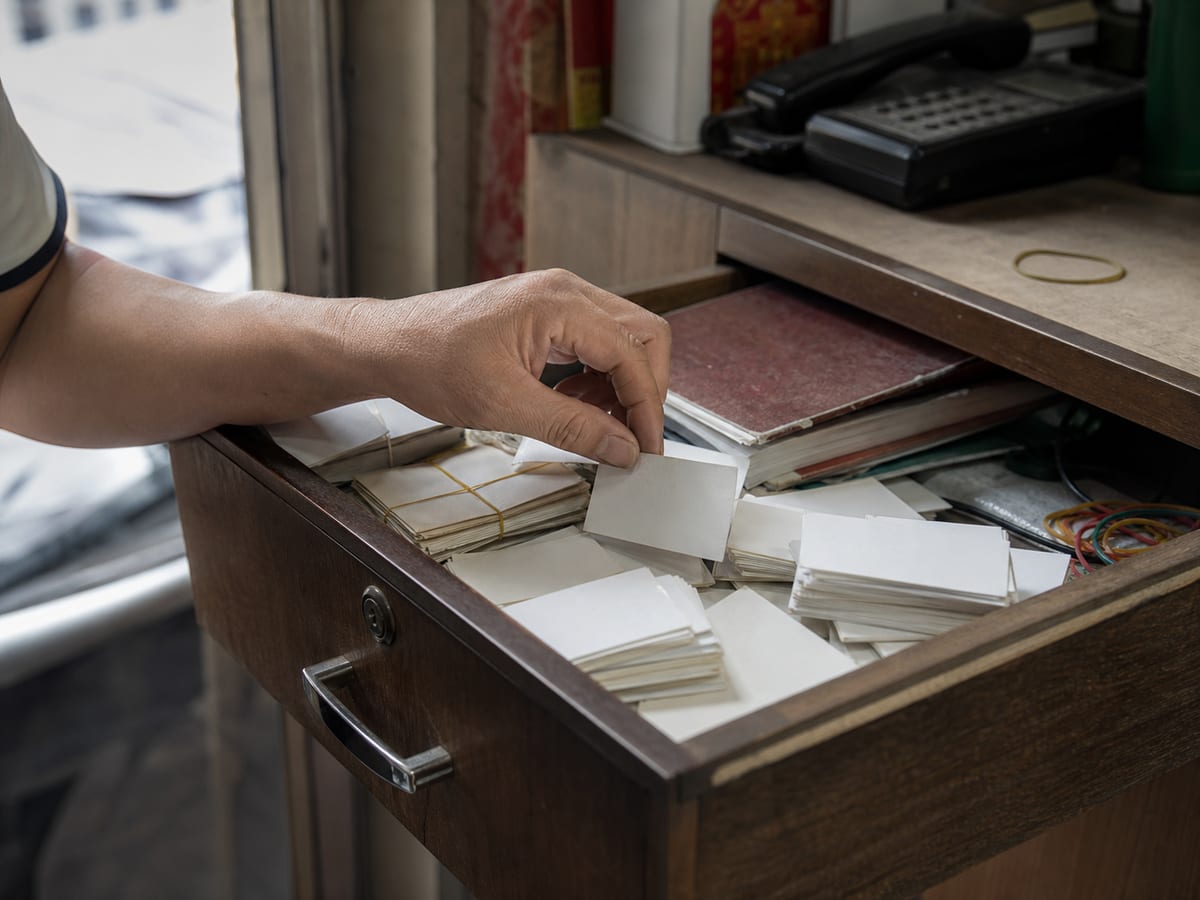 A contextual drawer of business cards that were never followed up